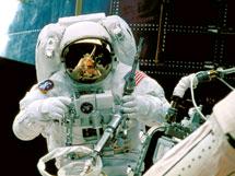 NASA astronaut on spacewalk on space shuttle